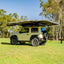 small rooftop tent on yellow car outdoors